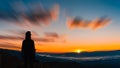 Young hipster photographer holding the camera with sunset on mountain natural background Royalty Free Stock Photo