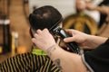 Back view of young man in barbershop. Hair care service concept Royalty Free Stock Photo