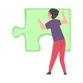 Back View of Young Man Solving Jigsaw Puzzle, Guy Trying to Connect Big Green Puzzle Element Cartoon Style Vector Royalty Free Stock Photo