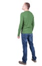 Back view of young man in t-shirt and jeans looking.