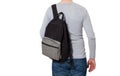 Back view. Young man wearing blank long sleeve t-shirt and backpack isolated on white background. Copy space. Advert Royalty Free Stock Photo