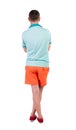 Back view of young manin shorts looking.