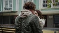 Happy couple kissing outdoor. Man and woman having romantic date on city street. Royalty Free Stock Photo