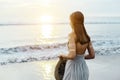 Young teenage girl thinking while looking at horizon on sunset Royalty Free Stock Photo