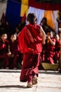 Back view of young Tibetan Buddhist Monk at the ancient Tiji Festival in walled city of Lo Manthang