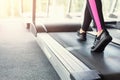 Woman`s feet on treadmill in fitness club, healthy lifestyle Royalty Free Stock Photo