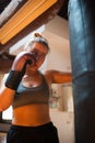 Back view of young woman at boxing training Royalty Free Stock Photo