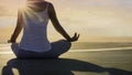 Back view young woman hand meditation lotus pose in sunlight mood on the rooftop building and evening sky scene