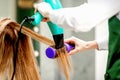 Young woman receiving drying hair Royalty Free Stock Photo