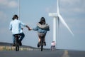 young woman riding a bicycle with her boyfriend on the road Royalty Free Stock Photo