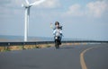 young woman riding a bicycle with her boyfriend on the road Royalty Free Stock Photo
