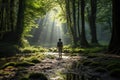 Back View of Young Woman Standing On Path In Forest between the woods Royalty Free Stock Photo