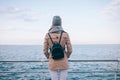 Back view of young woman wearing beige coat Royalty Free Stock Photo