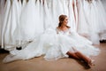 Back view of a young woman in wedding dress looking at bridal gowns Royalty Free Stock Photo