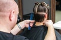 Back view woman receiving haircut Royalty Free Stock Photo