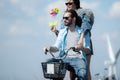 young woman riding a bicycle with her boyfriend on the road Royalty Free Stock Photo