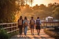 Back of walking asian teenager students with backpack at sunset. Generative AI