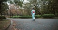 Back, walking and Japanese woman with traditional clothes, fresh air and wellness with hobby, routine and activity Royalty Free Stock Photo