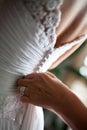 Back of a wedding dress being buttoned Royalty Free Stock Photo