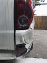 Back of white car get damaged from accident on the road. Vehicle bumper dent broken by car crash. Road accidents and car insurance