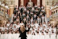 Back of a woman conducting a choir