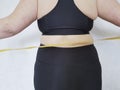 Back woman overweight centimeter fatness