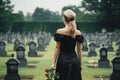 Back of woman wear all in black on cemetery. Grieving widow. Generative AI Royalty Free Stock Photo
