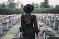 Back of woman wear all in black and hat on cemetery. Grieving widow. Generative AI Royalty Free Stock Photo