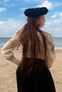 Woman back beach black rose crown, De Panne, Belgium Royalty Free Stock Photo