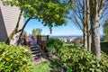 Back yard with lots of greenery, shrubs, trees and nice view. Royalty Free Stock Photo