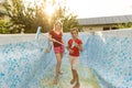 Back yard swimming pool behind modern single family home at pool opening with green stagnant algae filled water before Royalty Free Stock Photo