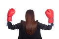 Back of young Asian businesswoman with boxing glove Royalty Free Stock Photo
