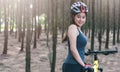 Back young female woman helmet catch bicycle Royalty Free Stock Photo