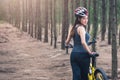 Back young female woman helmet catch bicycle Royalty Free Stock Photo