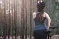 Back young female woman helmet catch bicycle Royalty Free Stock Photo