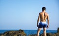 Back of young man shirtless against the sky Royalty Free Stock Photo