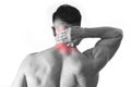 Back young muscular sport man holding sore neck touching massaging cervical area