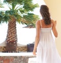 Back of a young woman in a white dress on a vacation Royalty Free Stock Photo