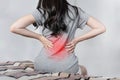 Backache and Lower back pain concept. Young woman suffering from back pain Royalty Free Stock Photo