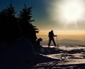 Backcountry skier reaching the summit Royalty Free Stock Photo