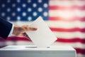 In the backdrop of the American flag, a man\'s hand casts his vote into the ballot box Royalty Free Stock Photo