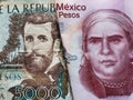 approach to colombian banknote of 5000 pesos and mexican banknote of fifty pesos