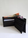 black leather wallet with australian banknotes and white background Royalty Free Stock Photo