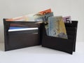 black leather wallet with australian banknotes and white background Royalty Free Stock Photo