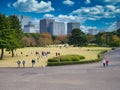 With a backdrop of city skyscrapers, a view the Imperial Palace East Gardens in Tokyo, Japan