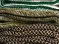 Backdrop of drains of knitted scarves folded on top of each other Royalty Free Stock Photo