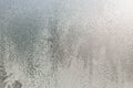 backdrop of ice, frozen window covered with frost, blue abstract backgrounds. Royalty Free Stock Photo