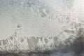backdrop of ice, frozen window covered with frost, blue abstract backgrounds. Royalty Free Stock Photo
