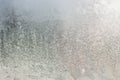 backdrop of ice, frozen window covered with frost, blue abstract backgrounds. Royalty Free Stock Photo