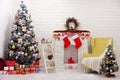 Backdrop interior room decorated in Christmas style with Christmas tree and gift boxes